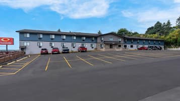 A motel with a parking lot, multiple rooms, and a visible sign for EconoLodge.