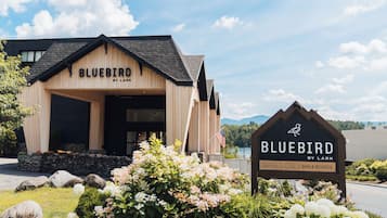 Welcome to Bluebird by Lark, a charming retreat with a cozy entrance and lush surroundings.