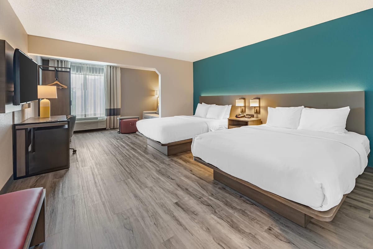 Premium bedding, desk, laptop workspace, blackout curtains