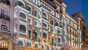 A multi-story hotel with ornate architecture, large windows, and balconies. - Catalonia Gran Via Madrid (Madrid)