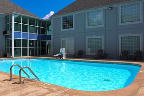 Seasonal outdoor pool, open 9:00 AM to 10:00 PM, pool umbrellas