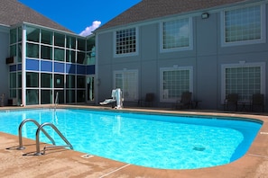 Seasonal outdoor pool, open 9:00 AM to 10:00 PM, pool umbrellas