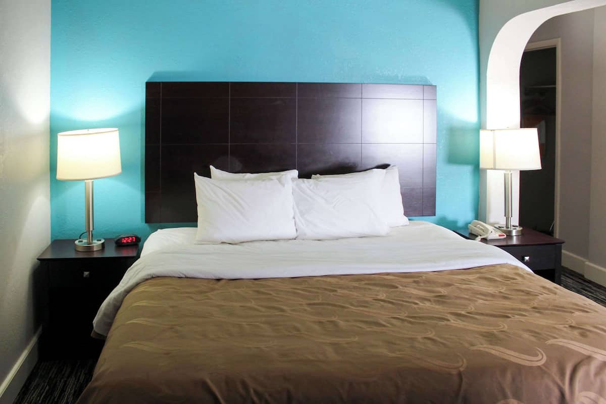 premium bedding, desk, laptop workspace, blackout curtains