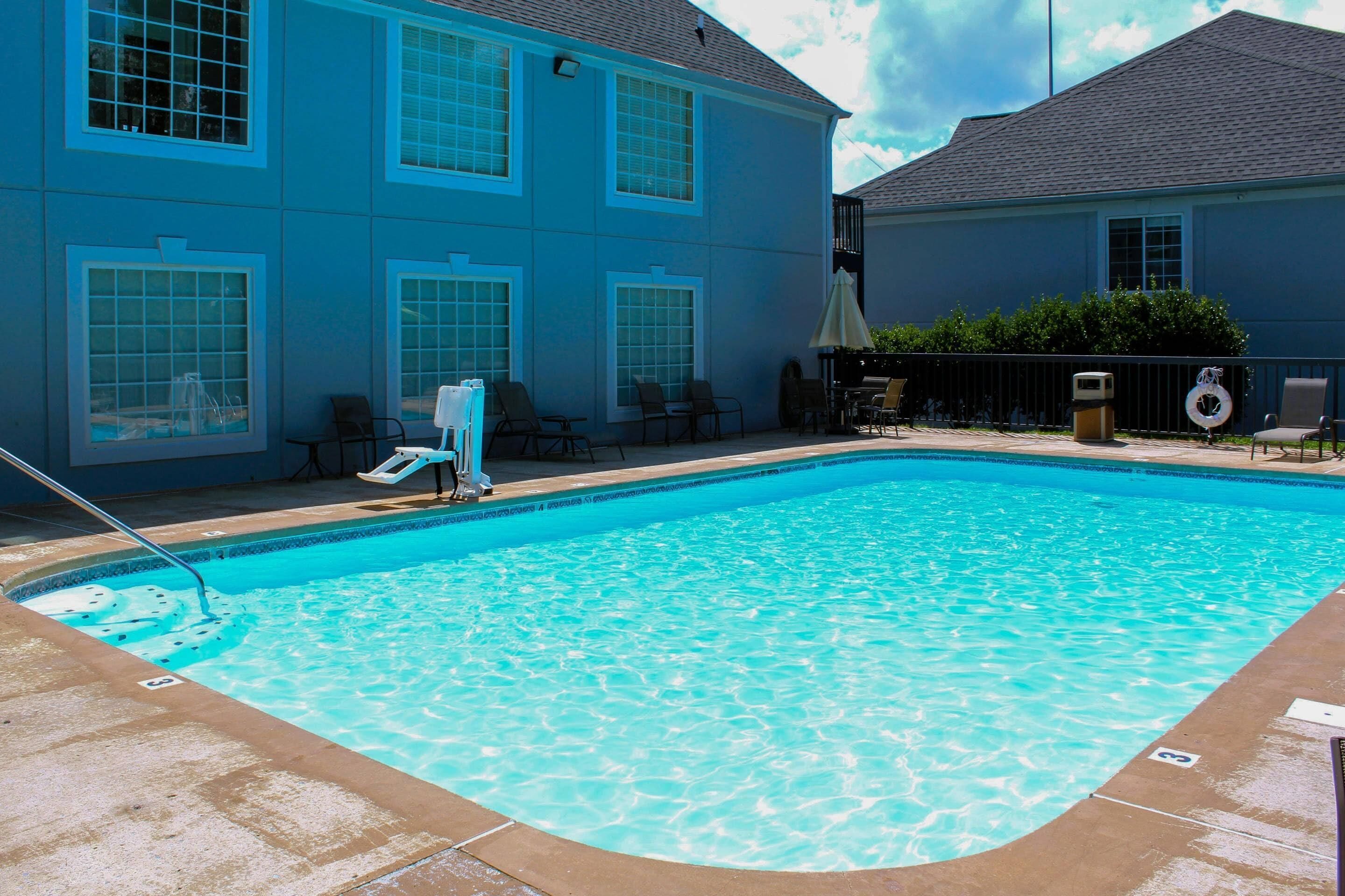 Seasonal outdoor pool, open 9:00 AM to 10:00 PM, pool umbrellas