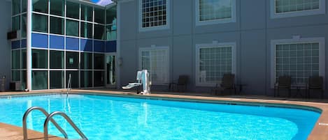 Seasonal outdoor pool, open 9:00 AM to 10:00 PM, pool umbrellas