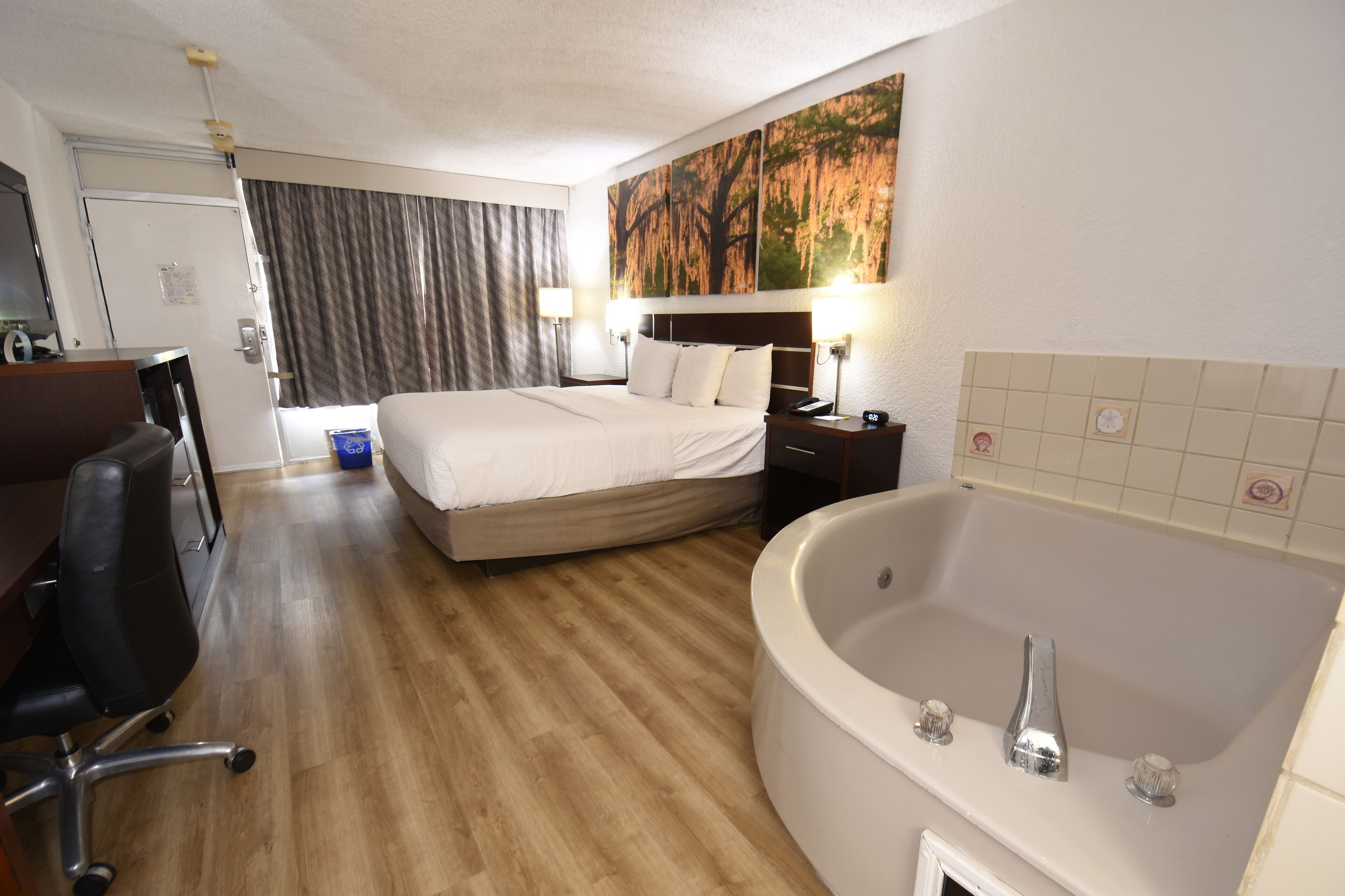 Superior Suite, 1 King Bed, Non Smoking, Jetted Tub | Desk, laptop workspace, blackout drapes, iron/ironing board