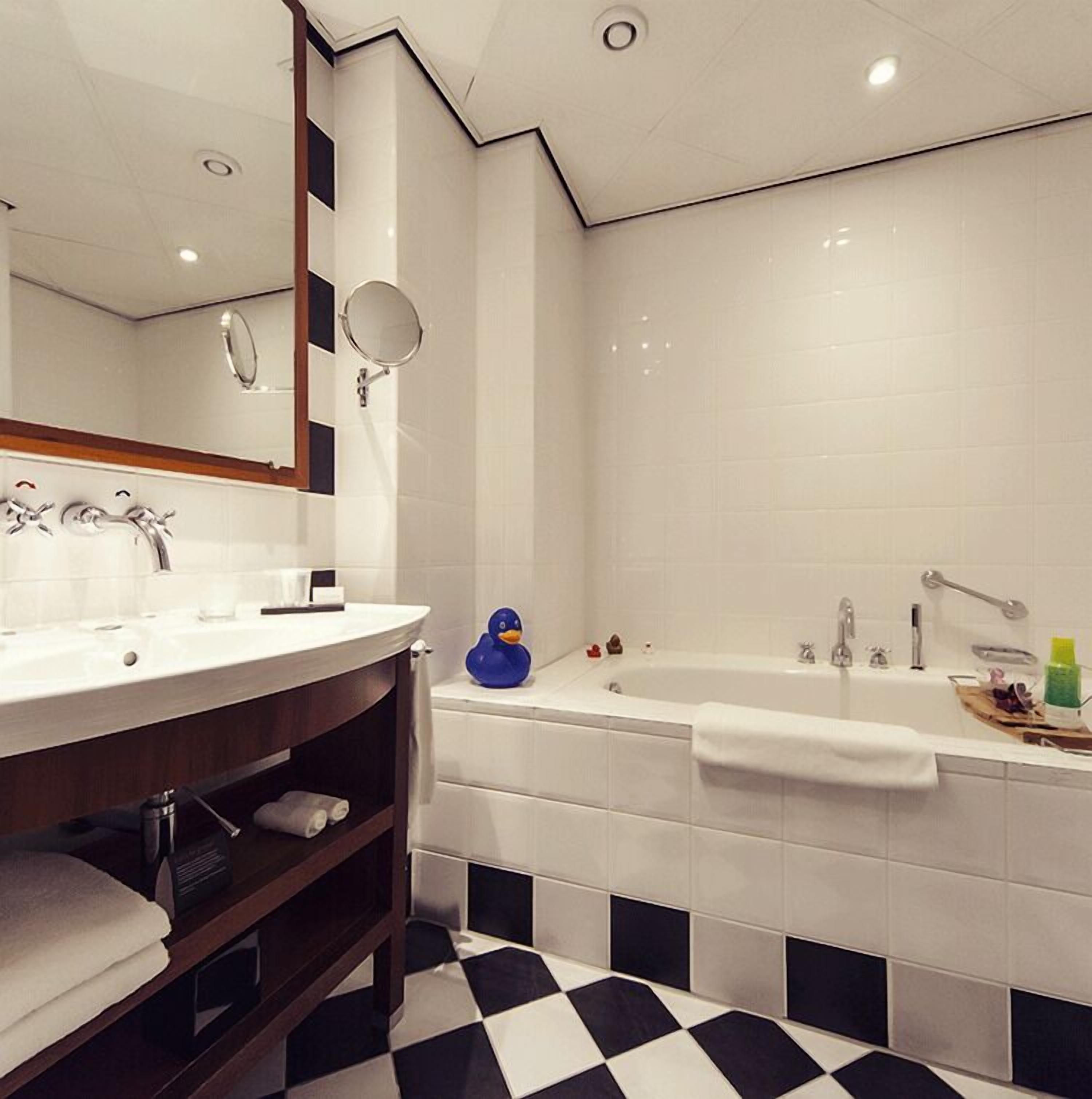 guest suite | bathroom | eco-friendly toiletries, hair dryer, bathrobes, slippers