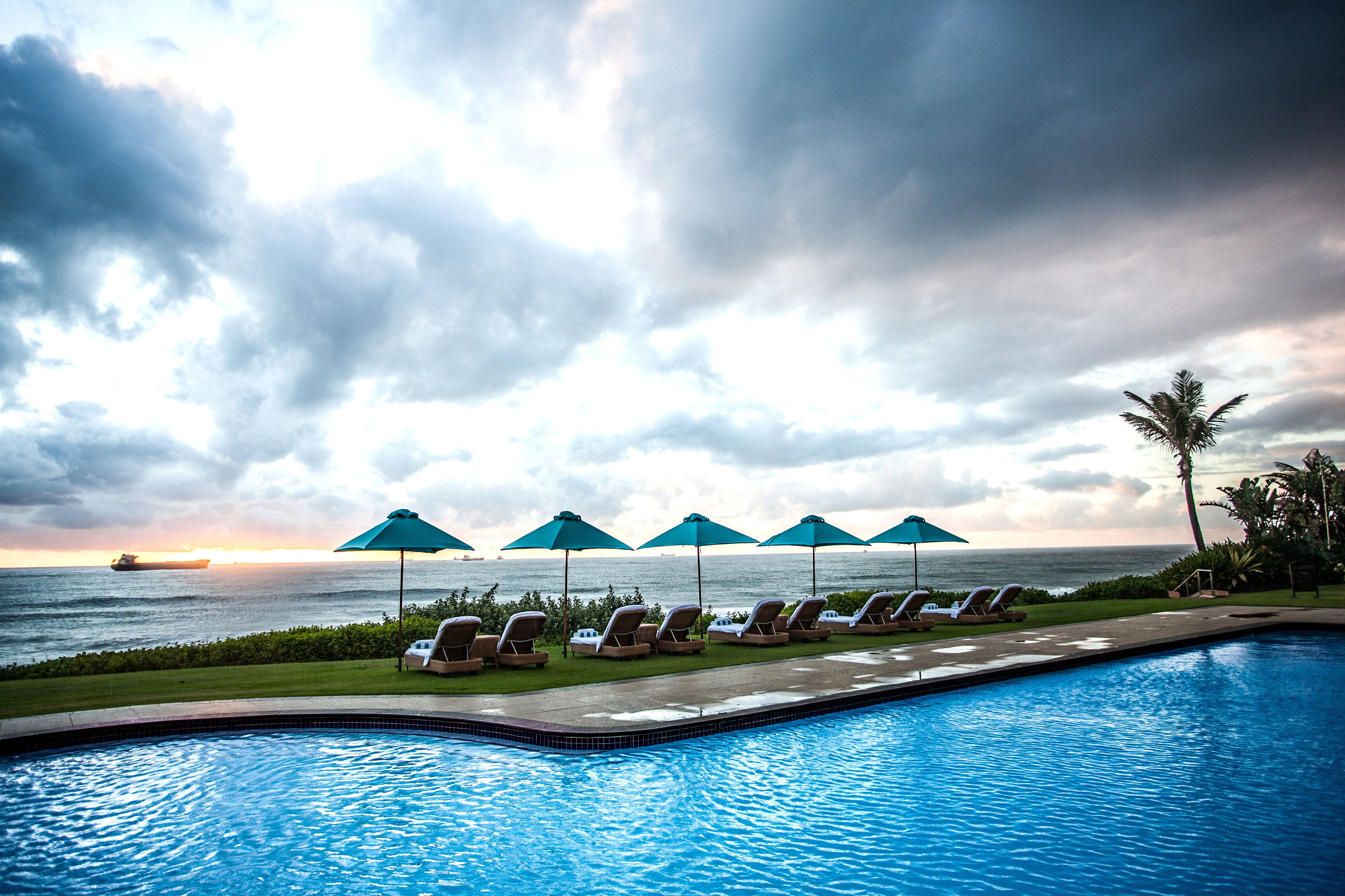 outdoor pool, pool umbrellas, pool loungers