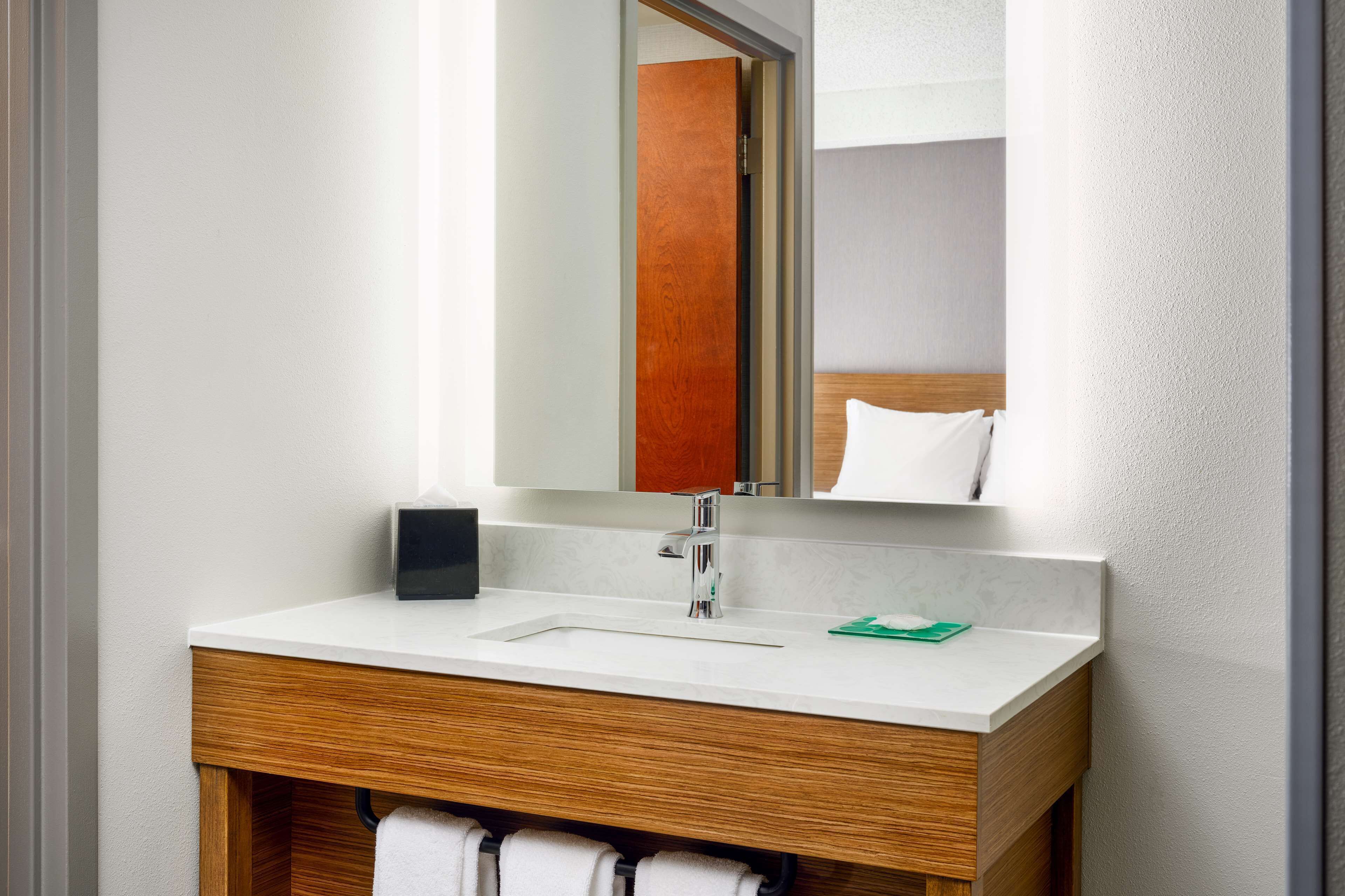 combined shower/bathtub, designer toiletries, hair dryer, towels