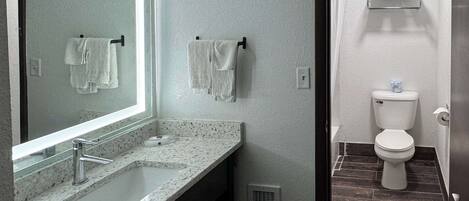 Shower, hair dryer, towels, shampoo