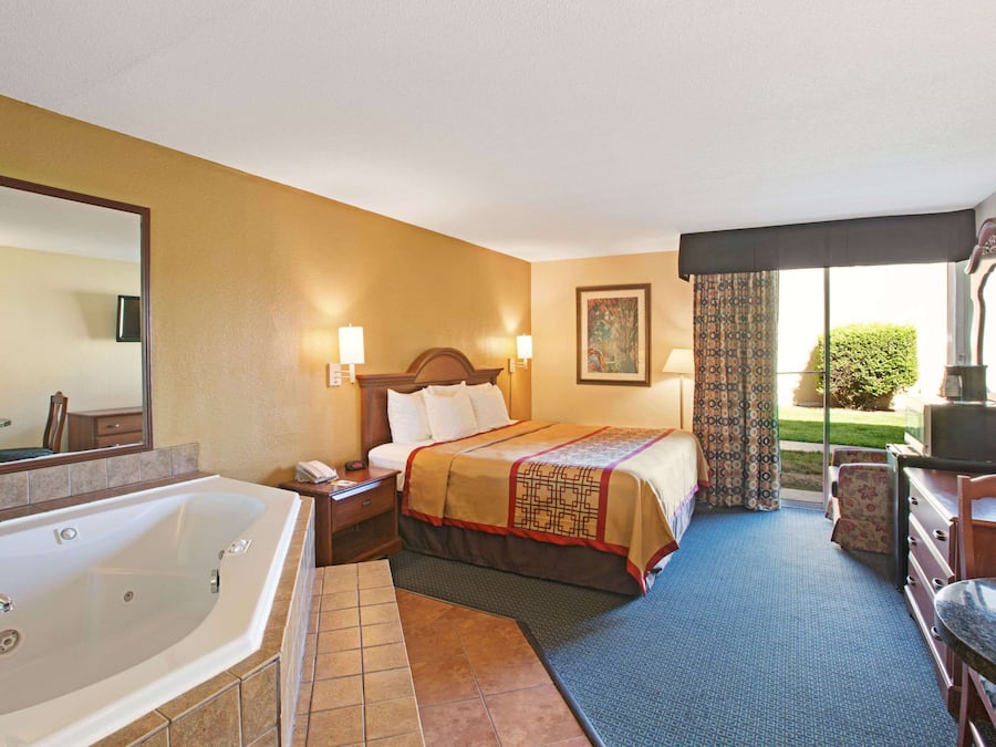 Desk, laptop workspace, blackout curtains, iron/ironing board