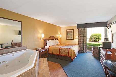 Desk, laptop workspace, blackout drapes, iron/ironing board