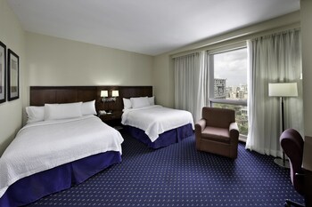 In-room safe, desk, blackout drapes, iron/ironing board at Courtyard by Marriott San Juan Miramar