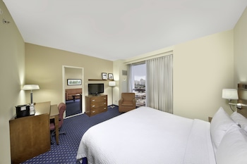 Suite, 1 Bedroom | In-room safe, desk, blackout drapes, iron/ironing board at Courtyard by Marriott San Juan Miramar
