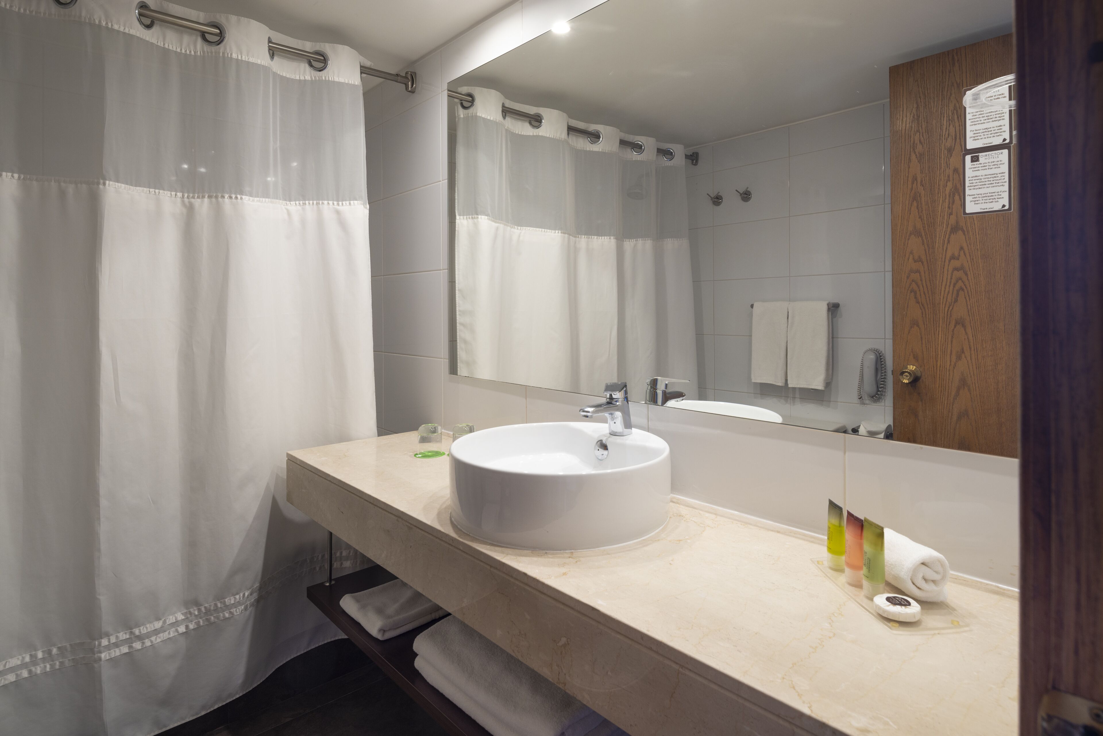 combined shower/bathtub, rainfall showerhead, designer toiletries