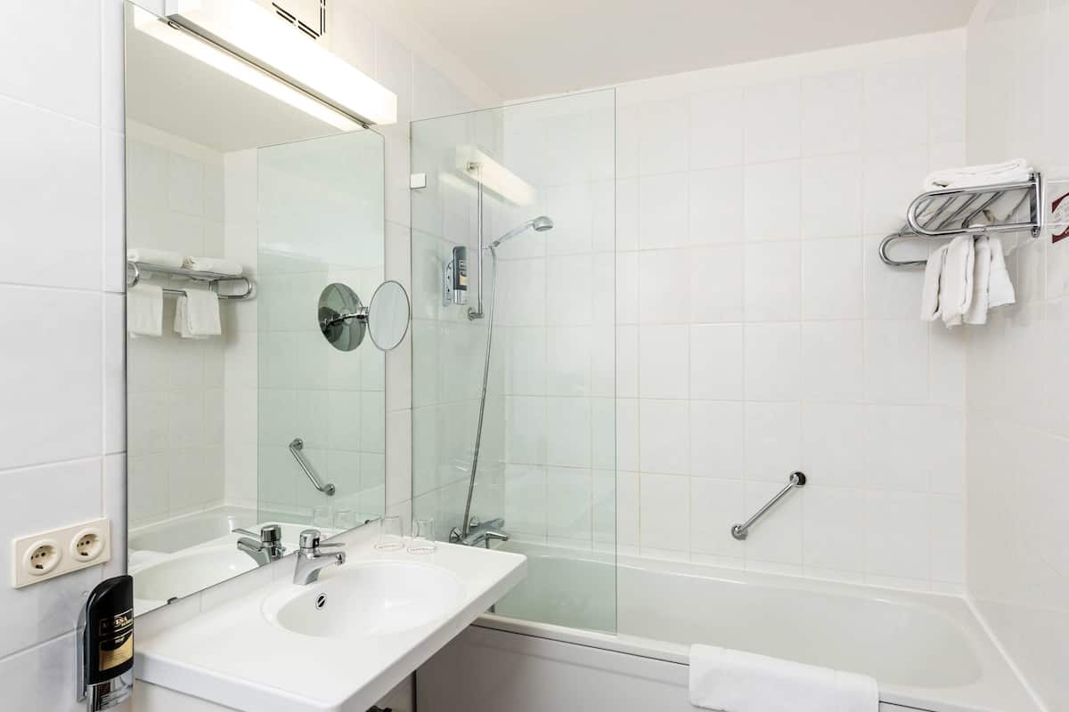 deep-soaking bathtub, free toiletries, hair dryer, towels