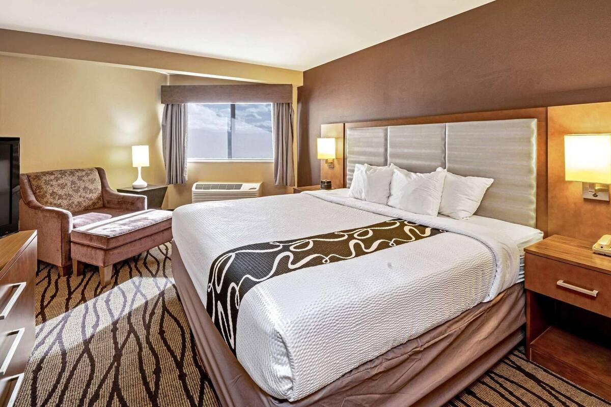 Premium bedding, pillow-top beds, desk, laptop workspace