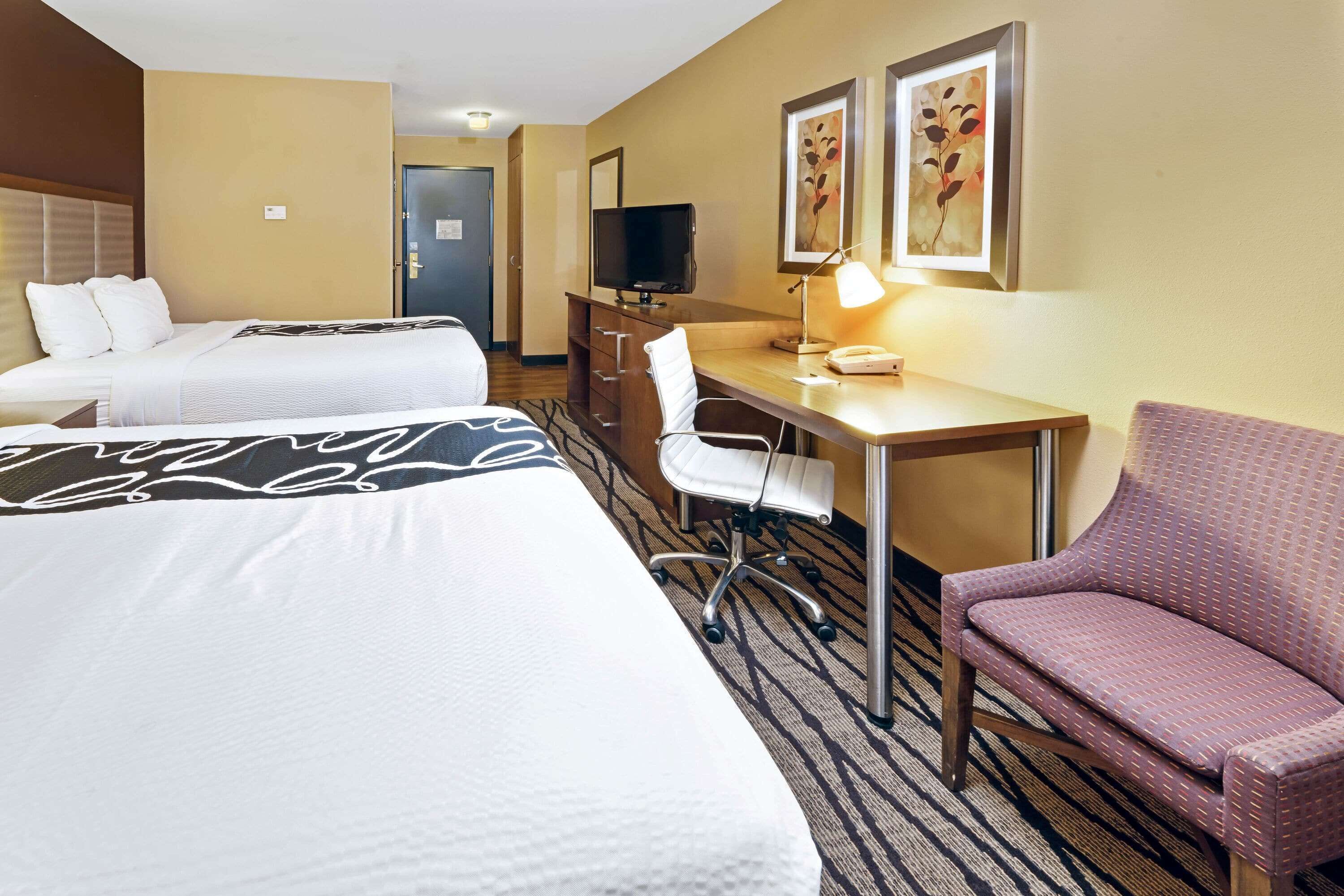 premium bedding, pillow-top beds, desk, laptop workspace