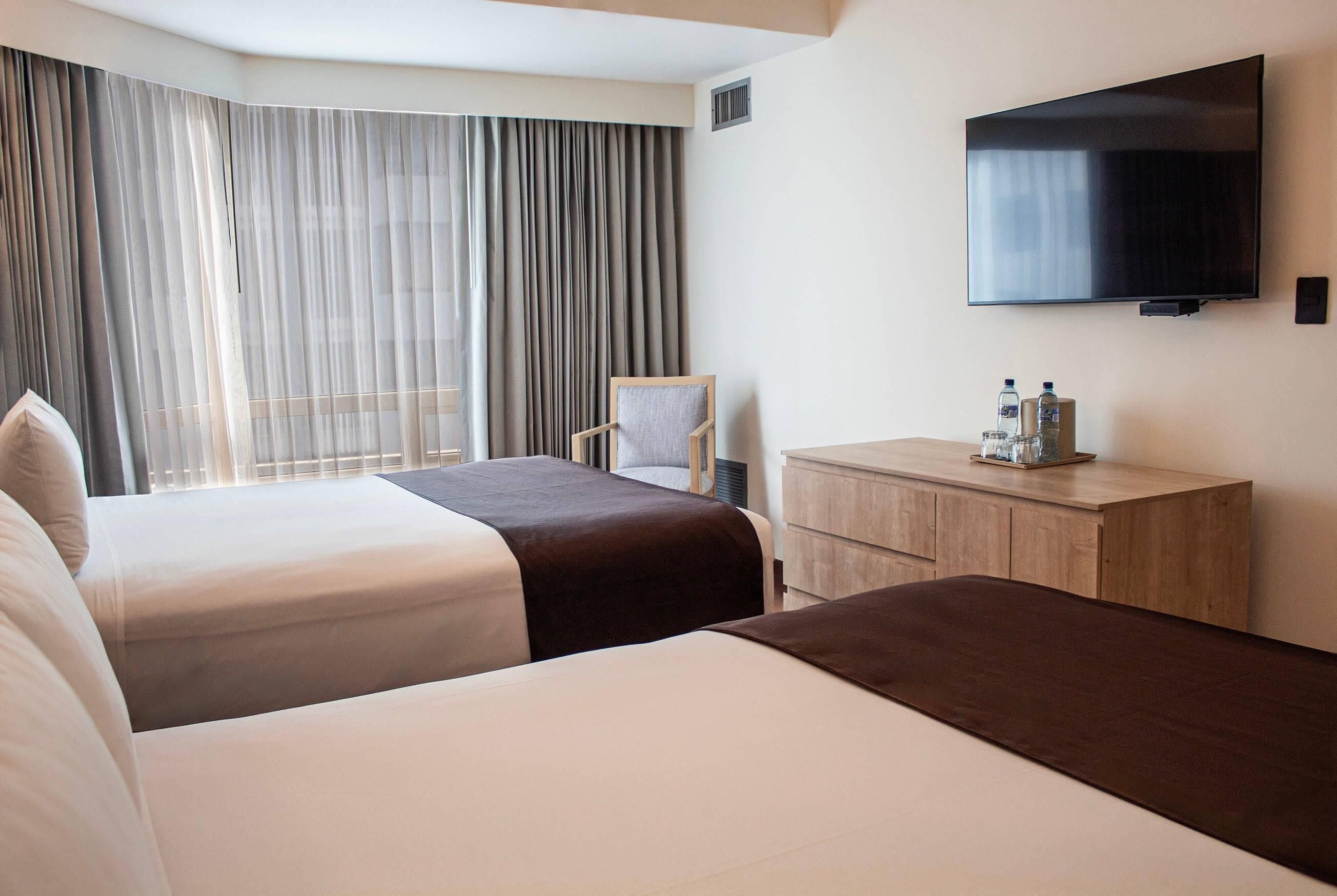 Suite, Multiple Beds, Non Smoking (Upgrade) | 1 bedroom, pillowtop beds, in-room safe, desk