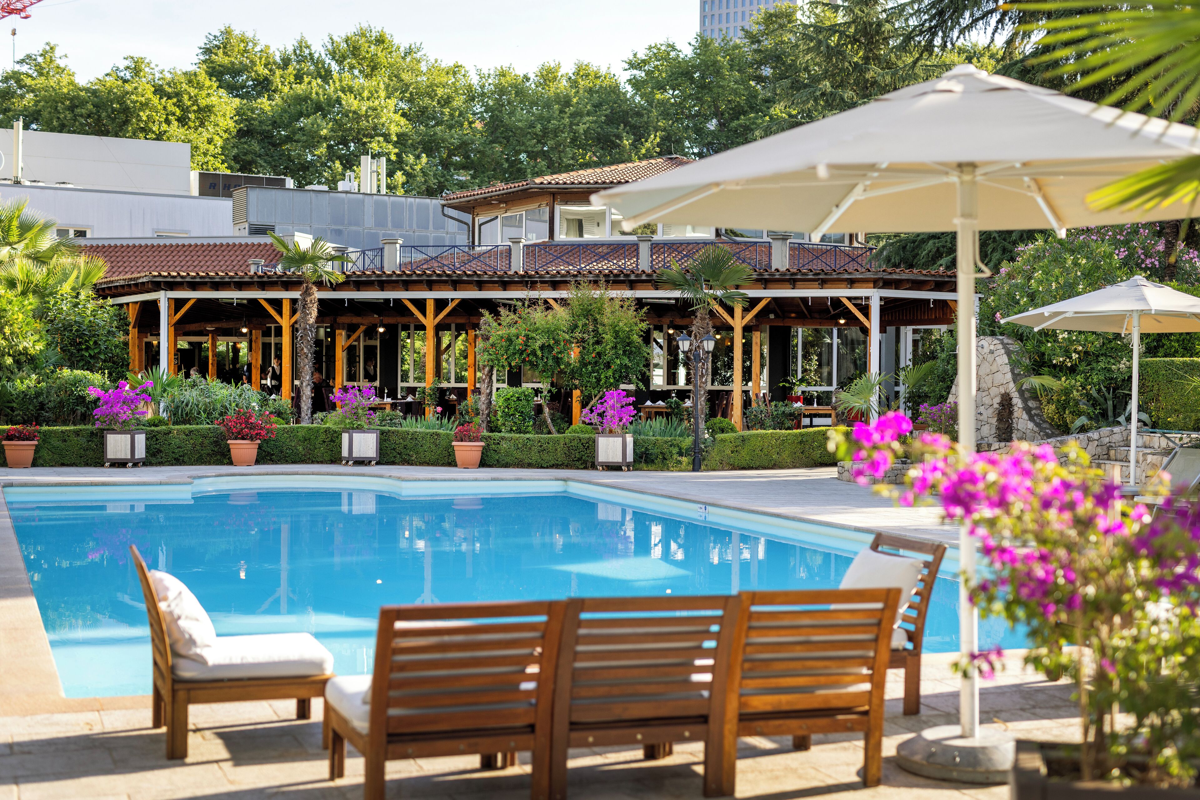 Seasonal outdoor pool, pool umbrellas, pool loungers