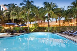 Outdoor pool, open 7 AM to 11 PM, pool umbrellas, sun loungers
