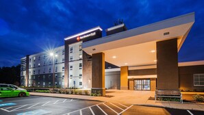 A hotel entrance with a sign reading "Best Western PLUS".