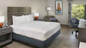 Premium bedding, desk, laptop workspace, blackout curtains