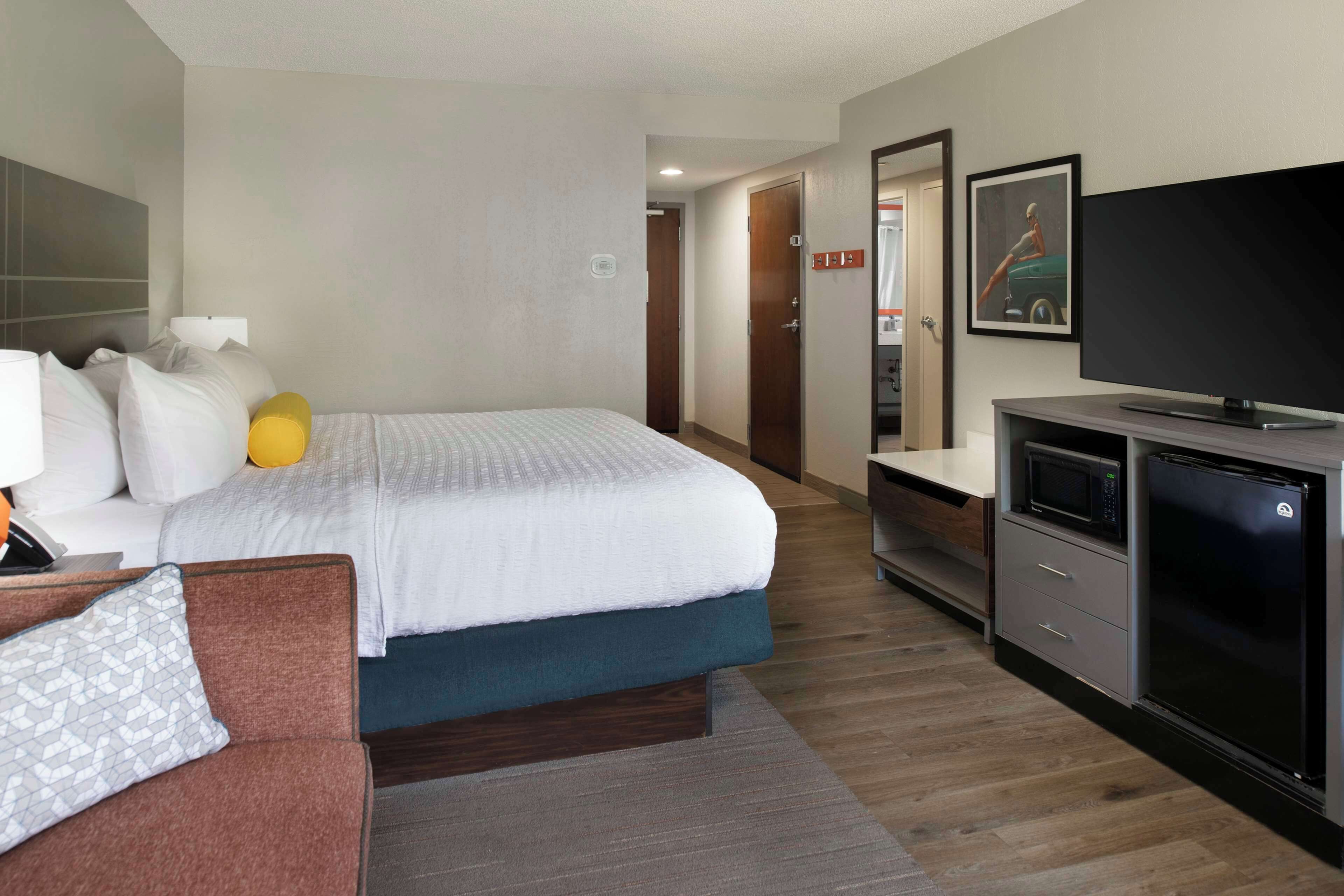 premium bedding, desk, laptop workspace, blackout curtains