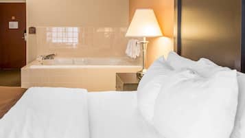 Suite, Non Smoking, Jetted Tub (1 King Bedroom) | Desk, iron/ironing board, free cribs/infant beds, rollaway beds