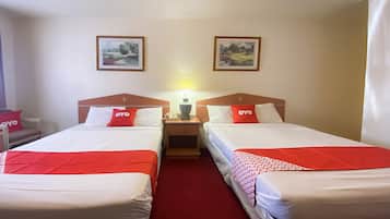 Desk, iron/ironing board, bed sheets, alarm clocks