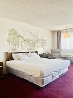 Desk, iron/ironing board, bed sheets, alarm clocks