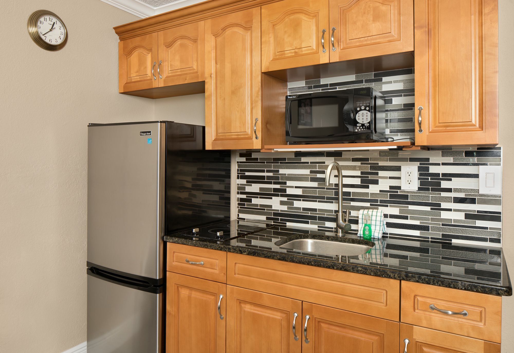 full-sized fridge, microwave, stovetop, coffee/tea maker