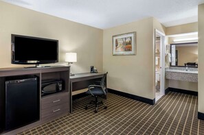Suite, 1 King Bed, Non Smoking | Premium bedding, in-room safe, laptop workspace, iron/ironing board