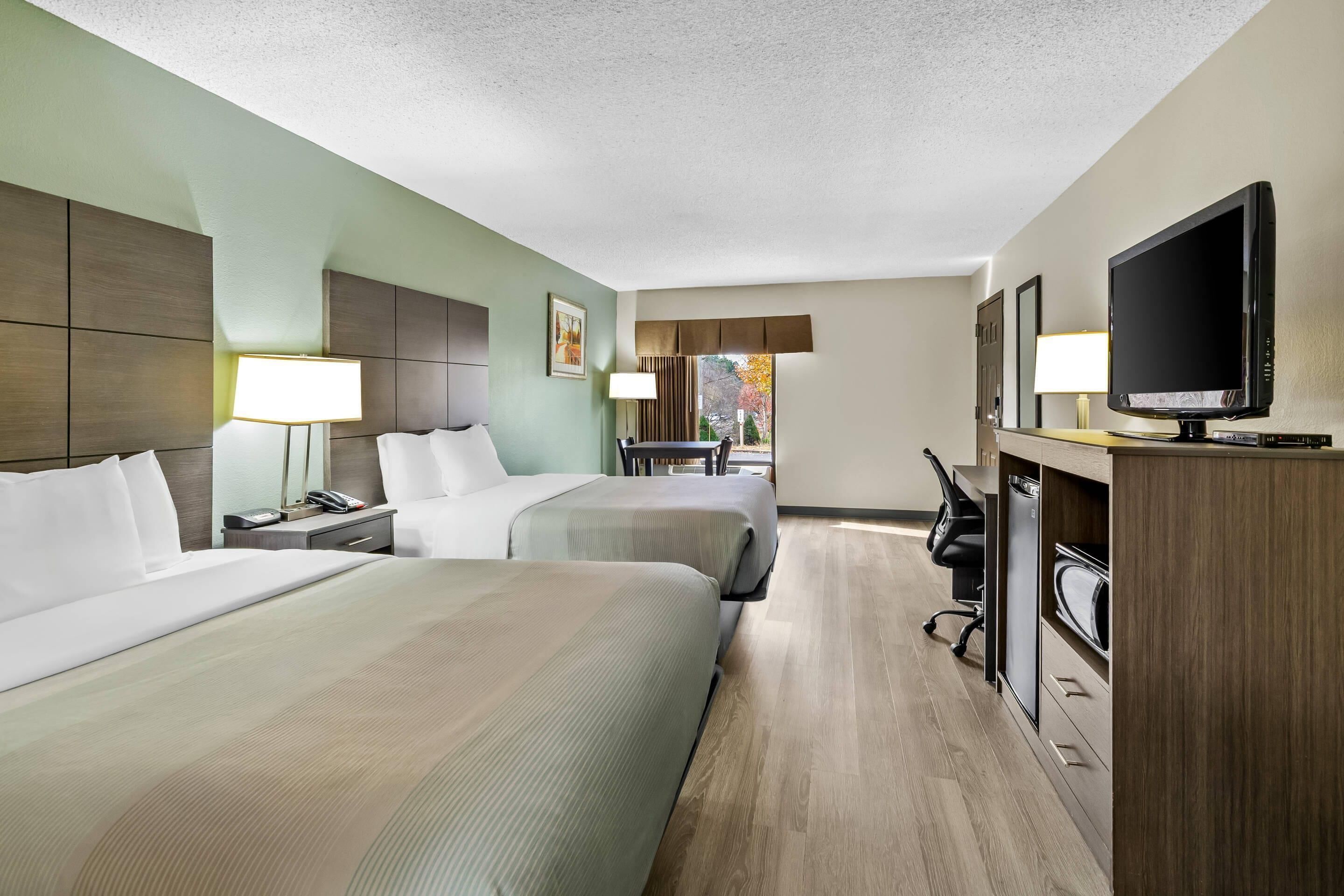 Room, 2 Queen Beds, Non Smoking | Premium bedding, in-room safe, laptop workspace, iron/ironing board