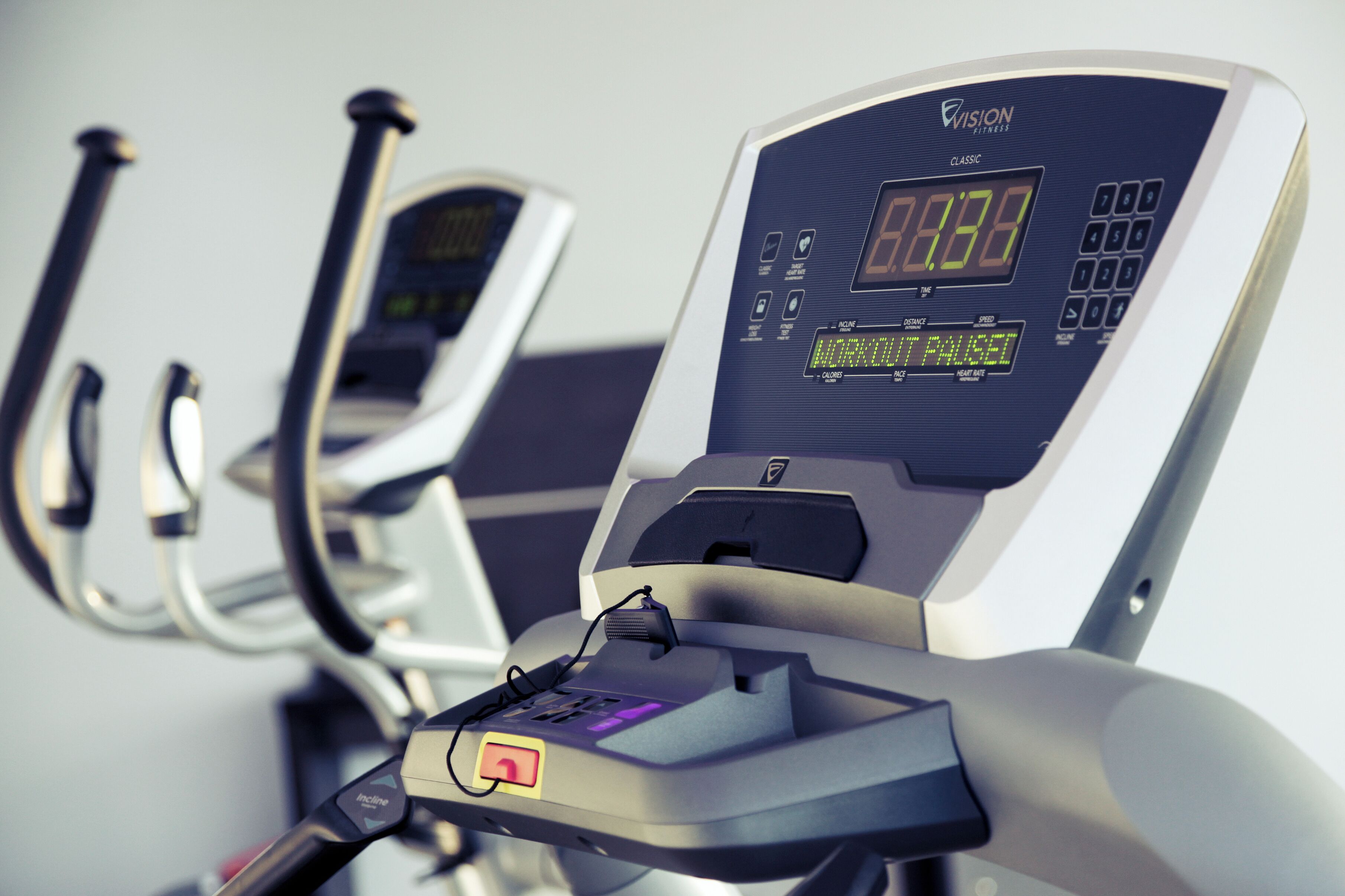 A stationary exercise bike with a digital display and control panel.