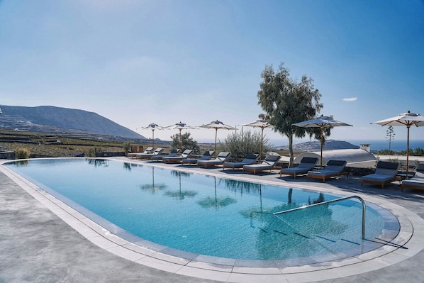 2 outdoor pools, pool umbrellas, pool loungers