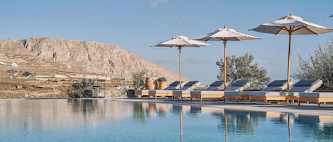 2 outdoor pools, pool umbrellas, pool loungers