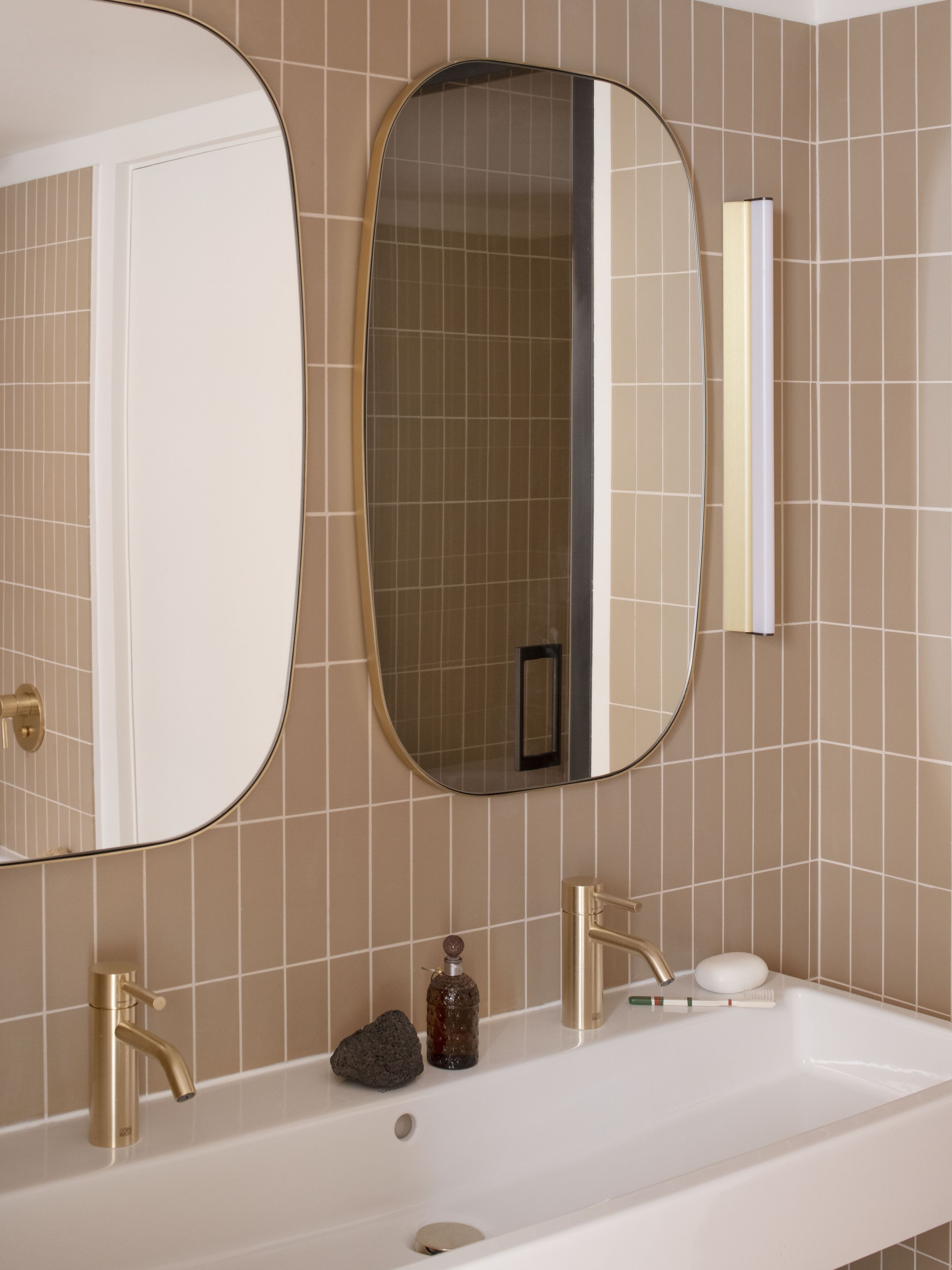 designer toiletries, hair dryer, slippers, towels