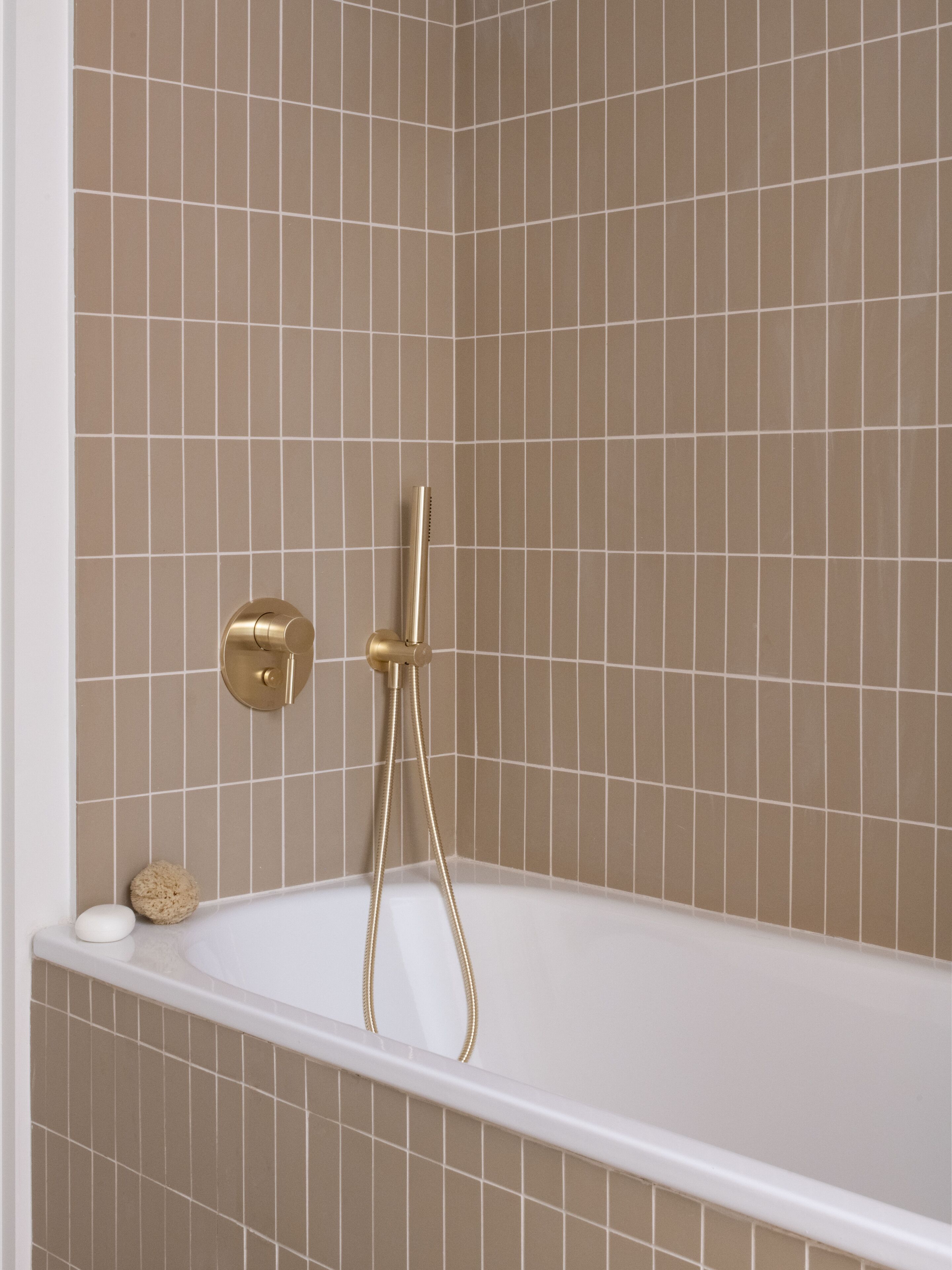 designer toiletries, hair dryer, slippers, towels