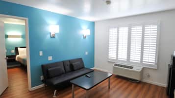 Deluxe Room, 2 Queen Beds, Non Smoking, Refrigerator & Microwave | Living room | TV