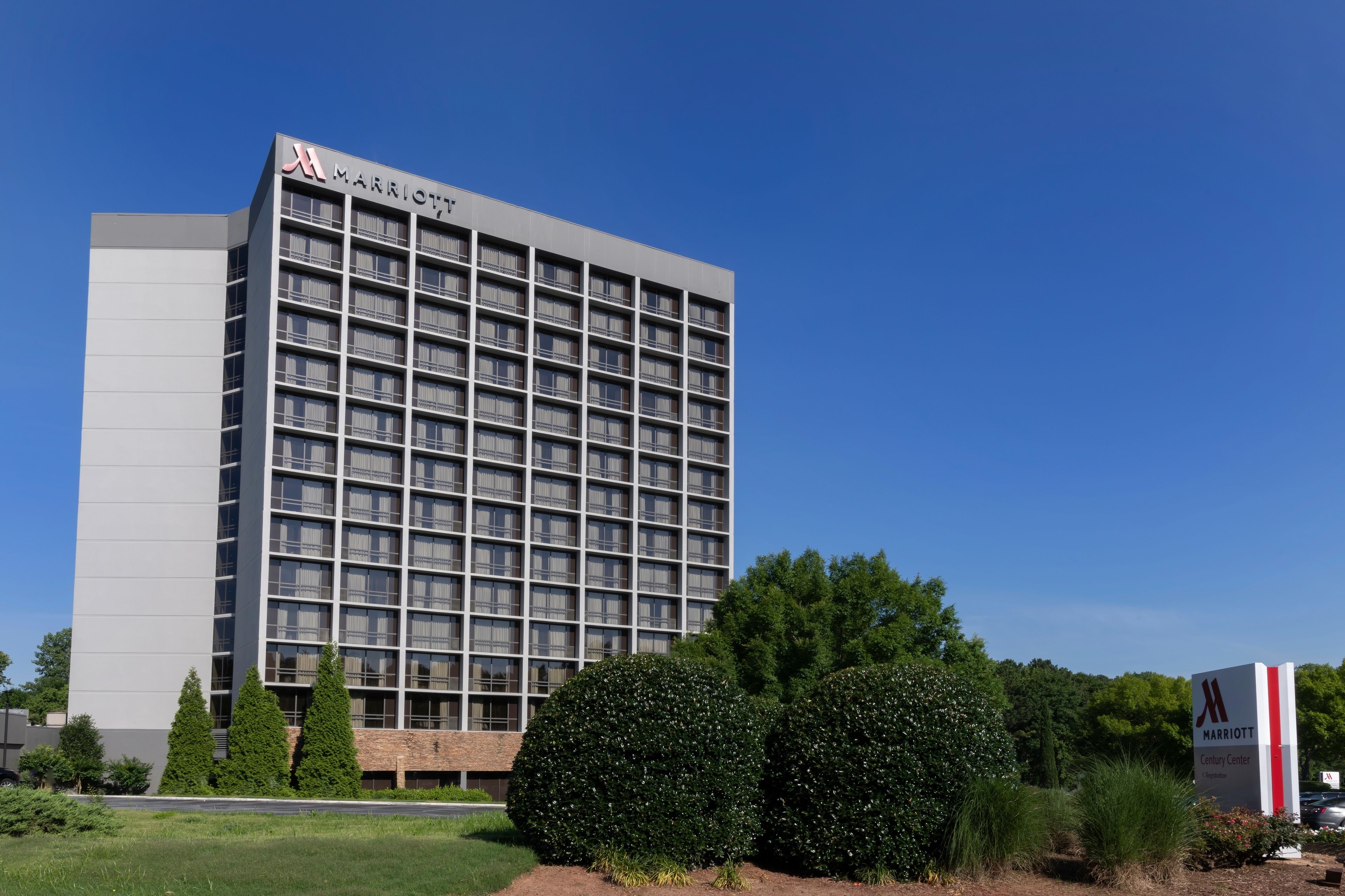 A multi-story hotel with a grid of windows, a prominent 'Marriott' sign, and a 'Century Center' label.