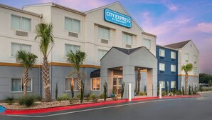 A CITY EXPRESS BY MARRIOTT hotel with a modern design, featuring a prominent entrance and multiple windows. - City Express By Marriott Lafayette (Lafayette)