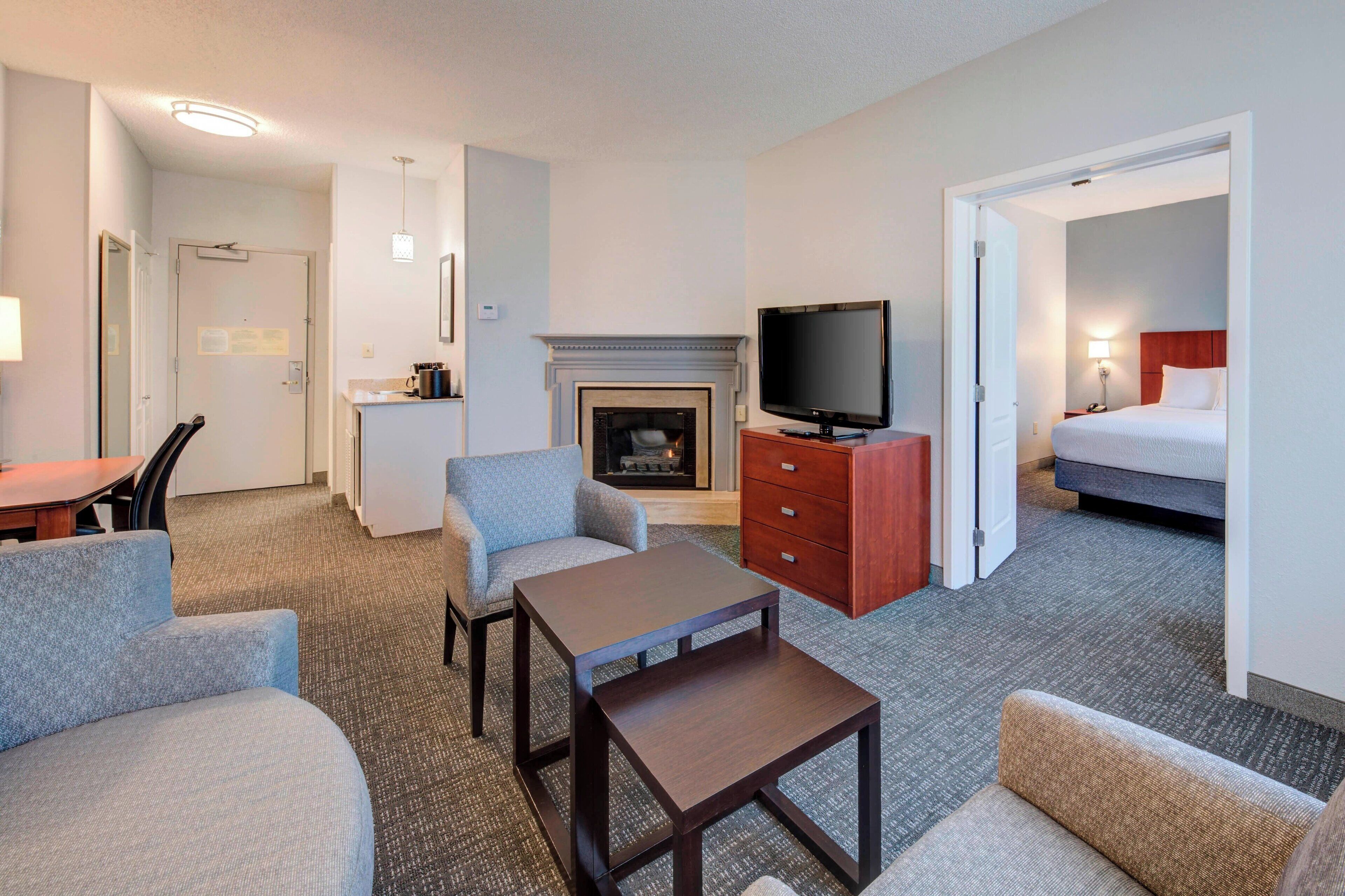 Executive Suite, 1 Bedroom | Desk, iron/ironing board, WiFi (free), bed sheets