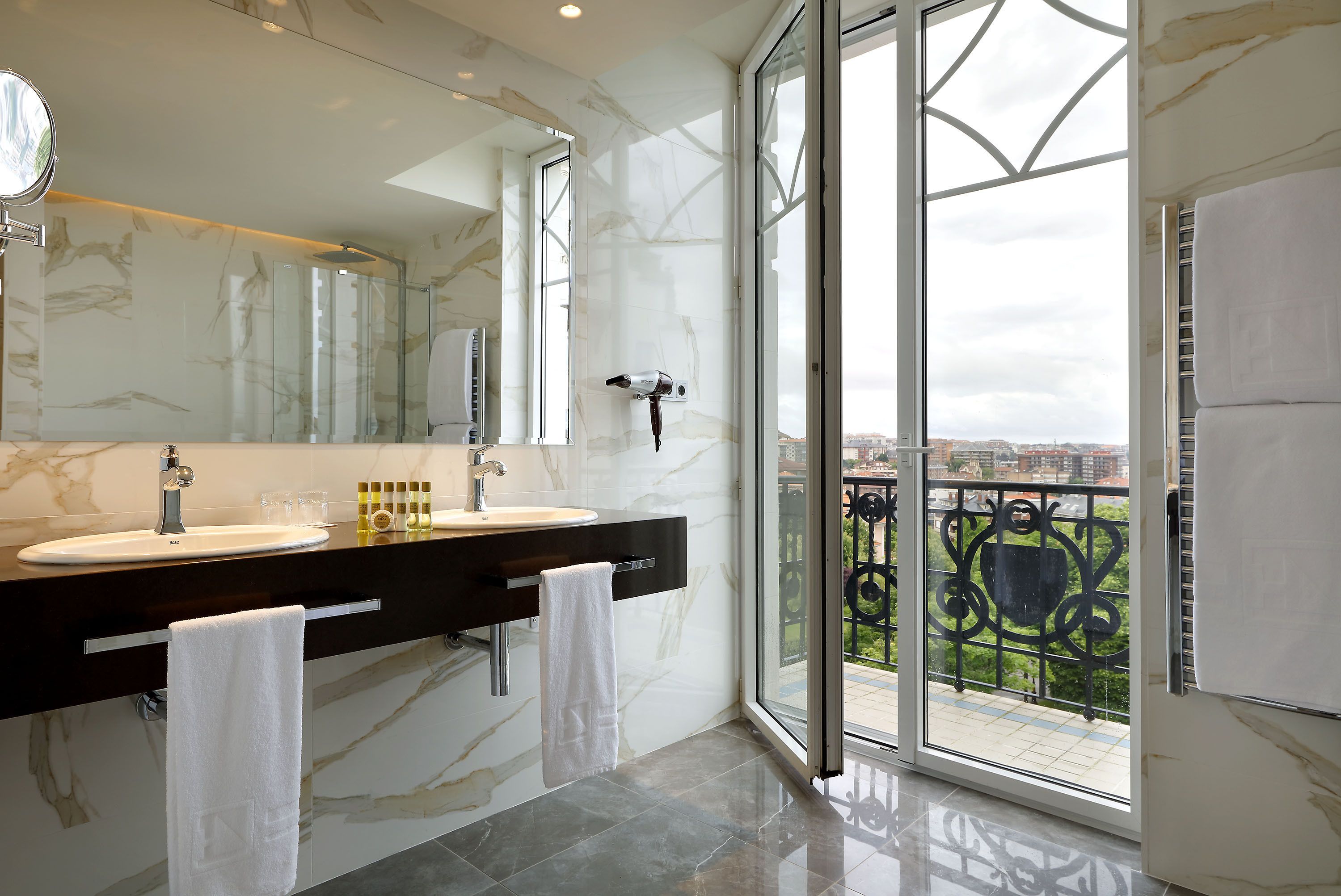 shower, eco-friendly toiletries, hair dryer, towels