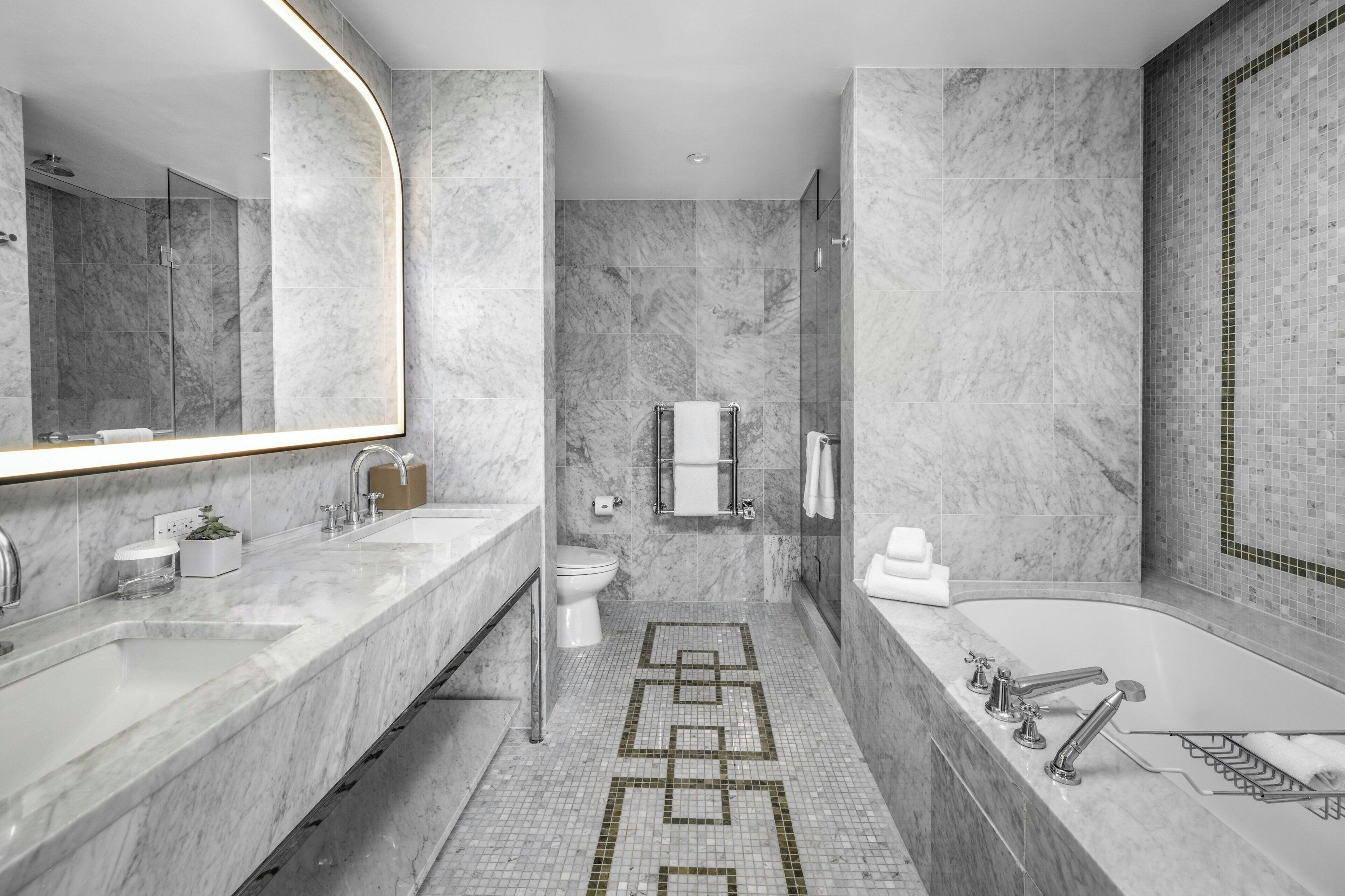 combined shower/bathtub, designer toiletries, hair dryer, bathrobes