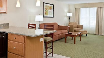 Suite, 1 King Bed | Living area | 32-inch TV with cable channels