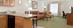Suite, 1 King Bed | Living area | 32-inch TV with cable channels - White River Inn and Suites (White River Junction)