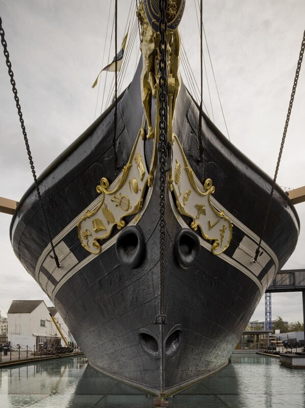 A large ship's bow with ornate gold detailing and a chain hanging from the top. - The Bristol Hotel (Bristol)
