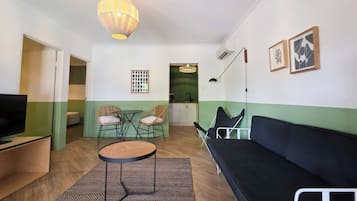 Toro Suite (Two Bedroom, Kitchenette) | Desk, laptop workspace, iron/ironing board, bed sheets