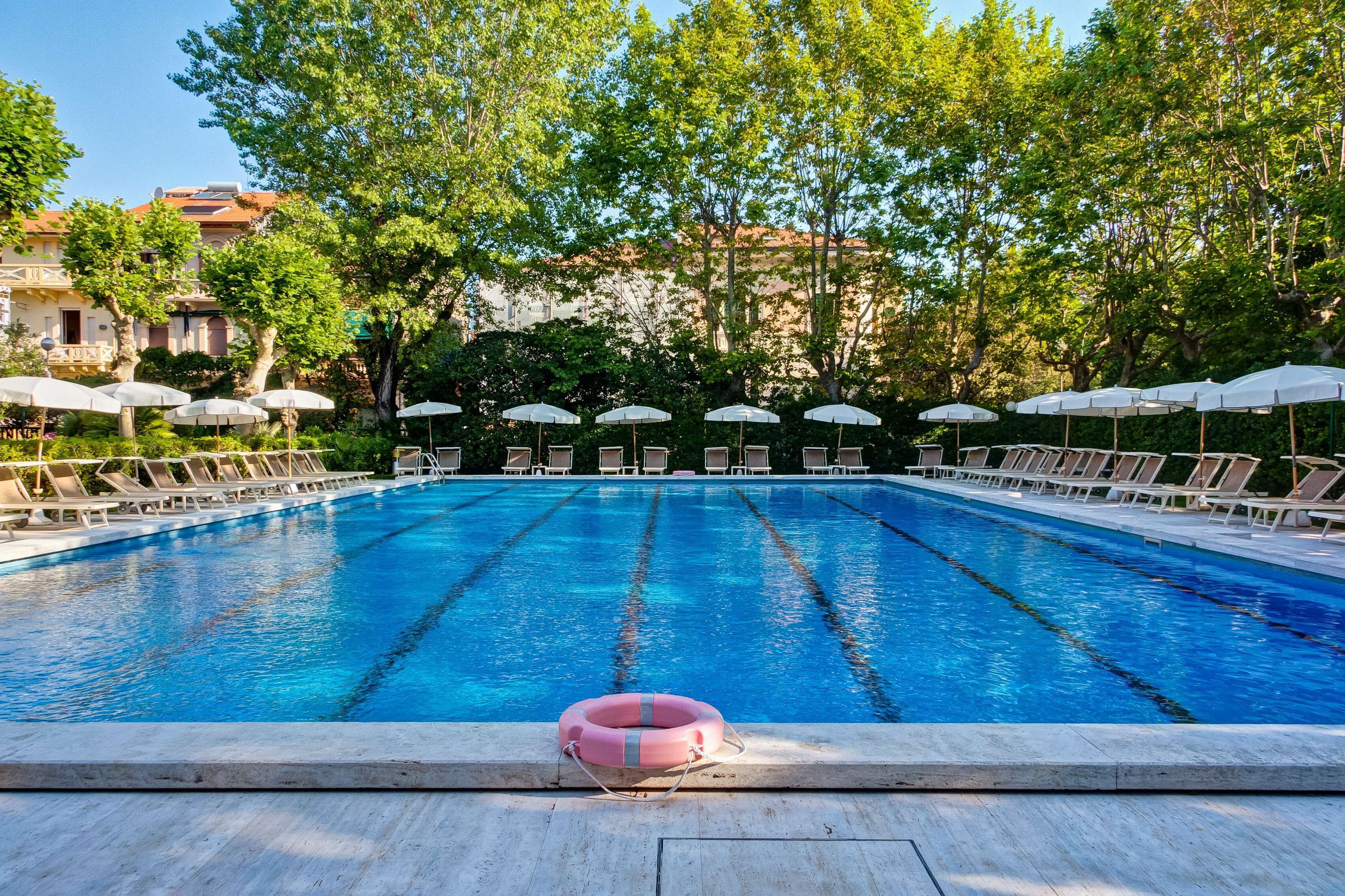 seasonal outdoor pool, open 10:00 am to 6:00 pm, pool umbrellas